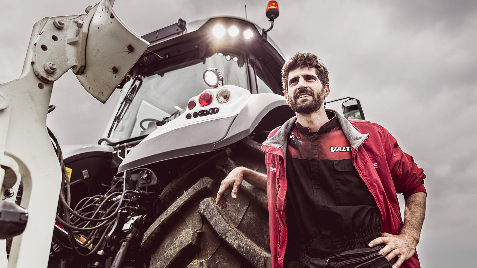 valtra tractor with man standing outside